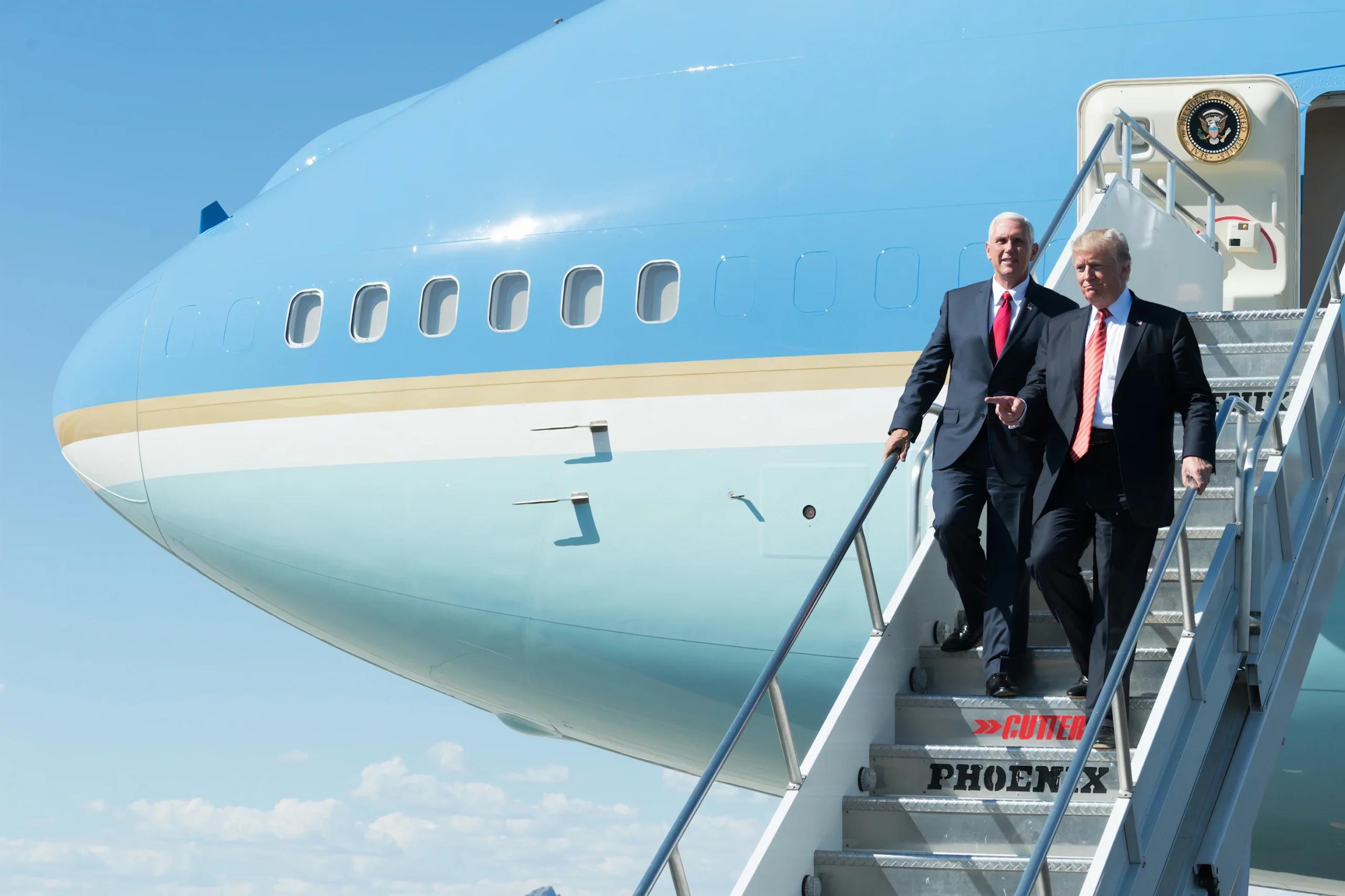 Donald Trump walking down a plane