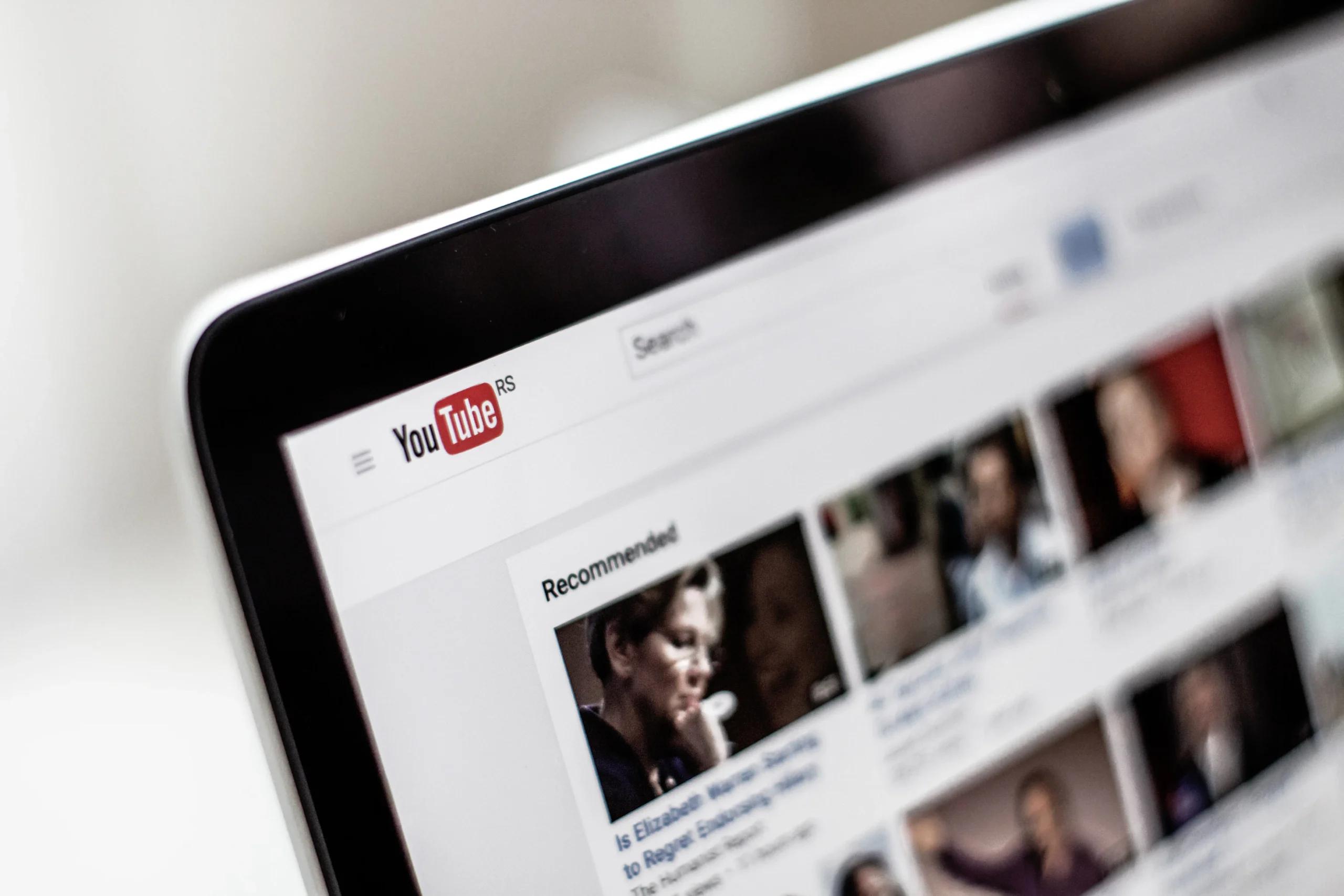 YouTube homepage shown on a laptop