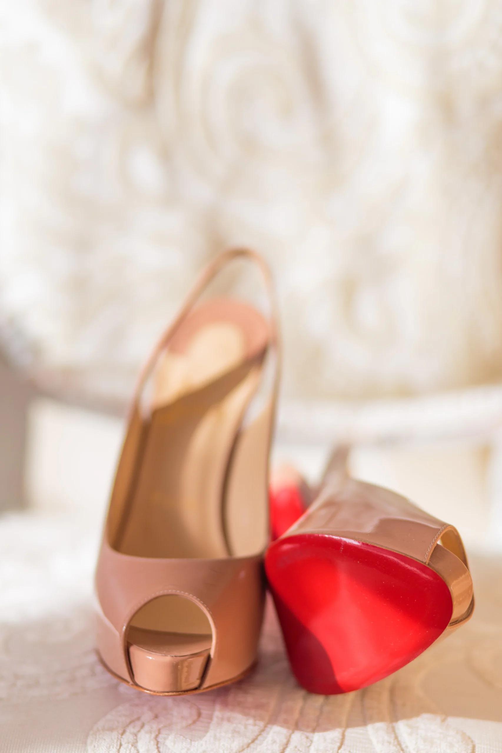 A pair of pink peep-toe heeled sandals