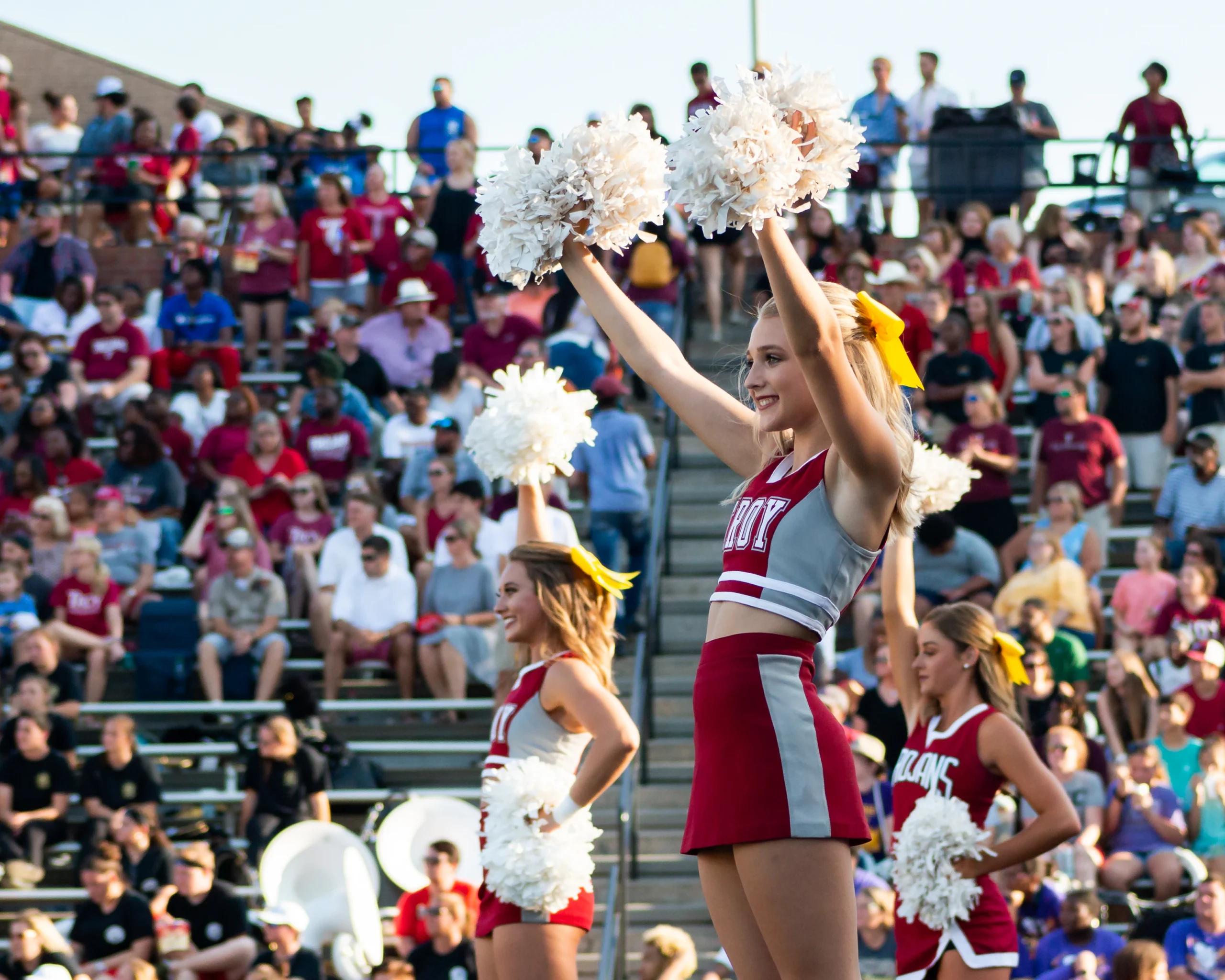 A group of cheerleaders at a sporting event