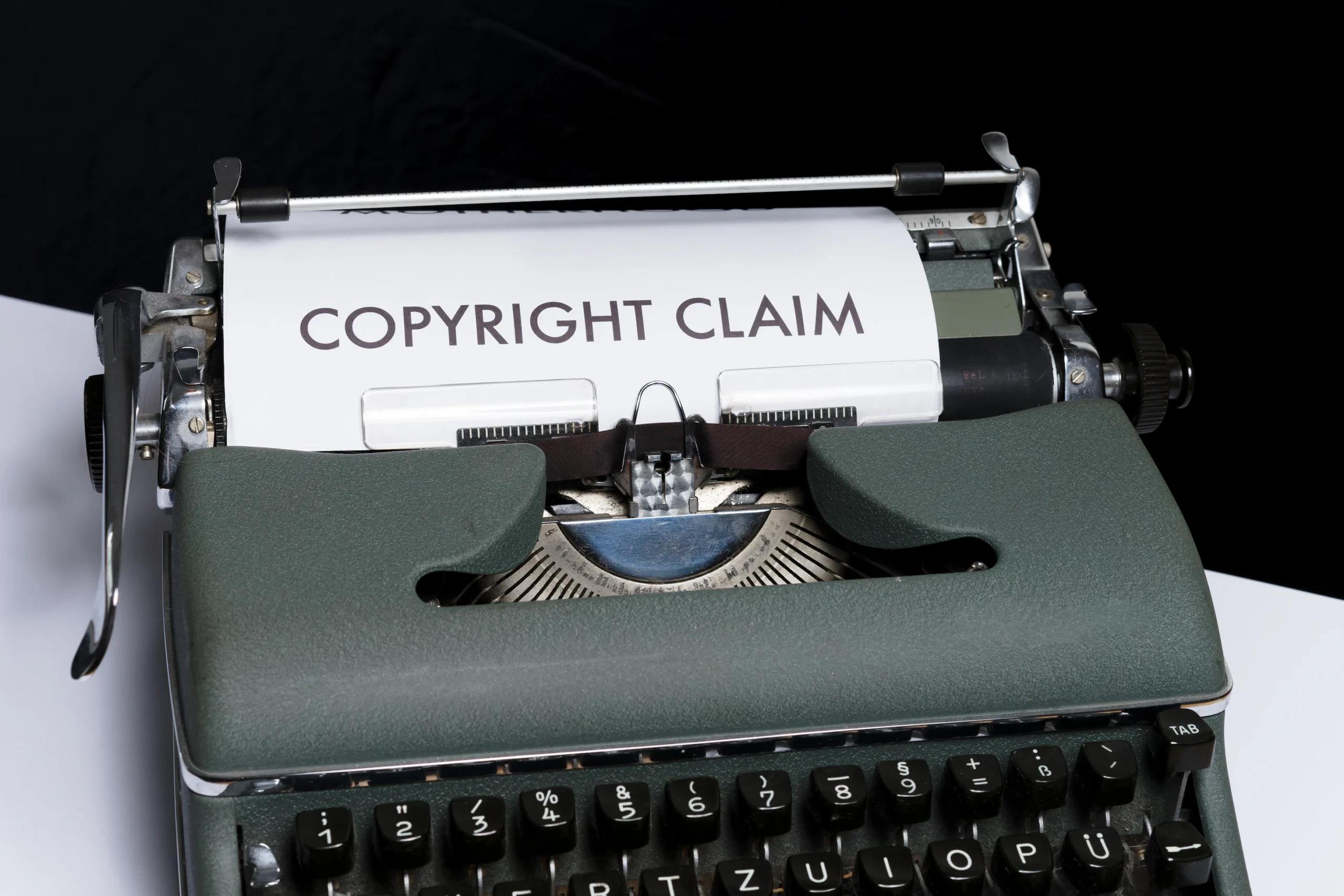 A typewriter printing out "Copyright Claim"