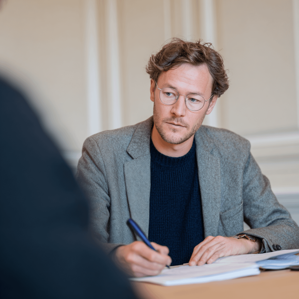 Man Writing at Desk